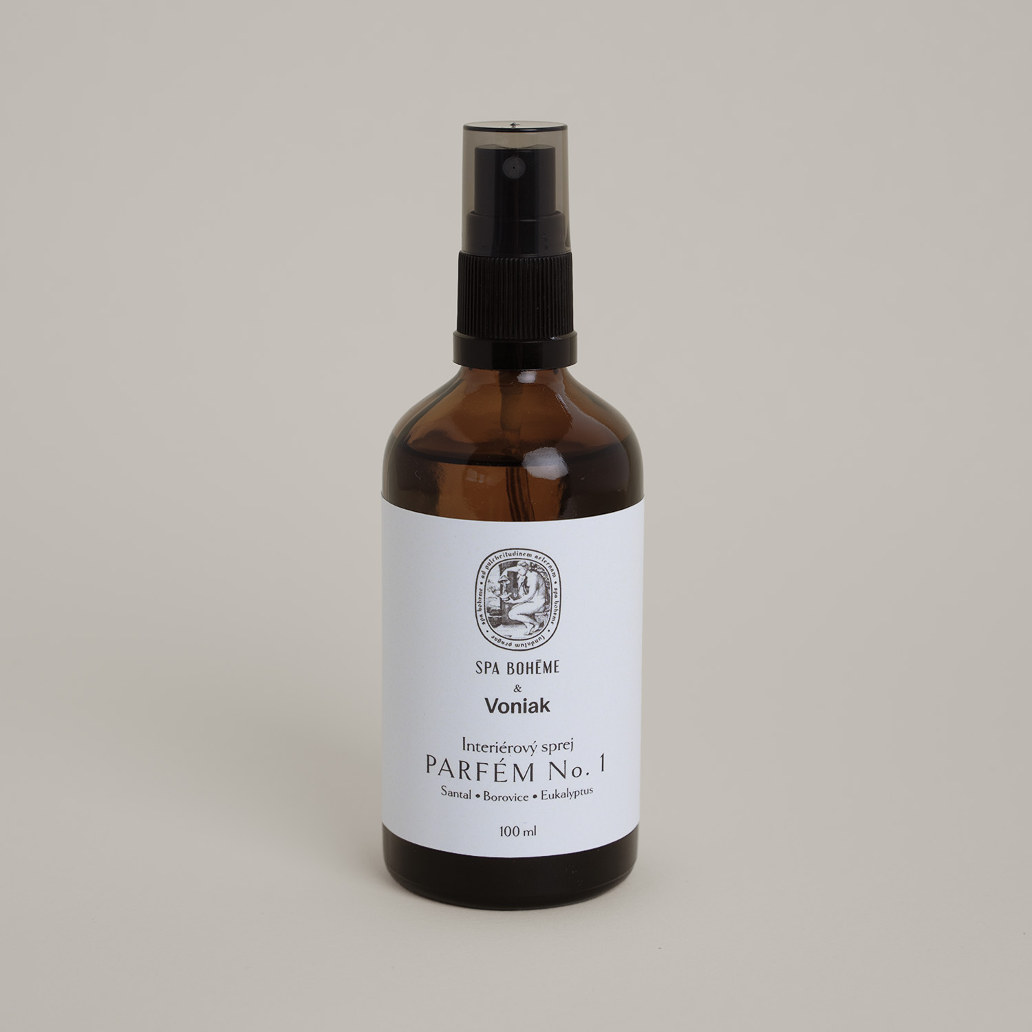 a bottle of liquid perfume with a white label