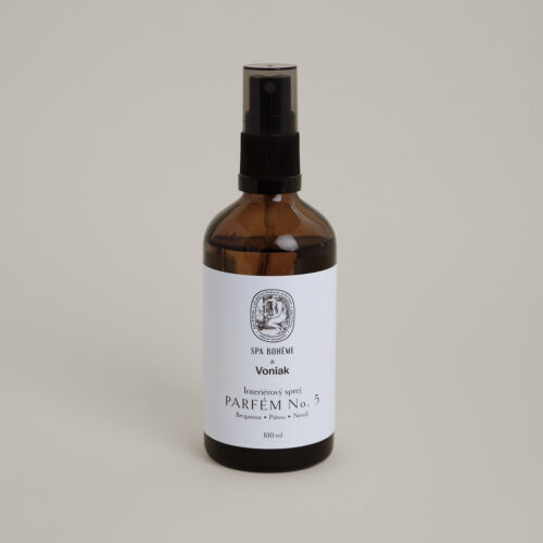 a bottle of liquid perfume with a white label