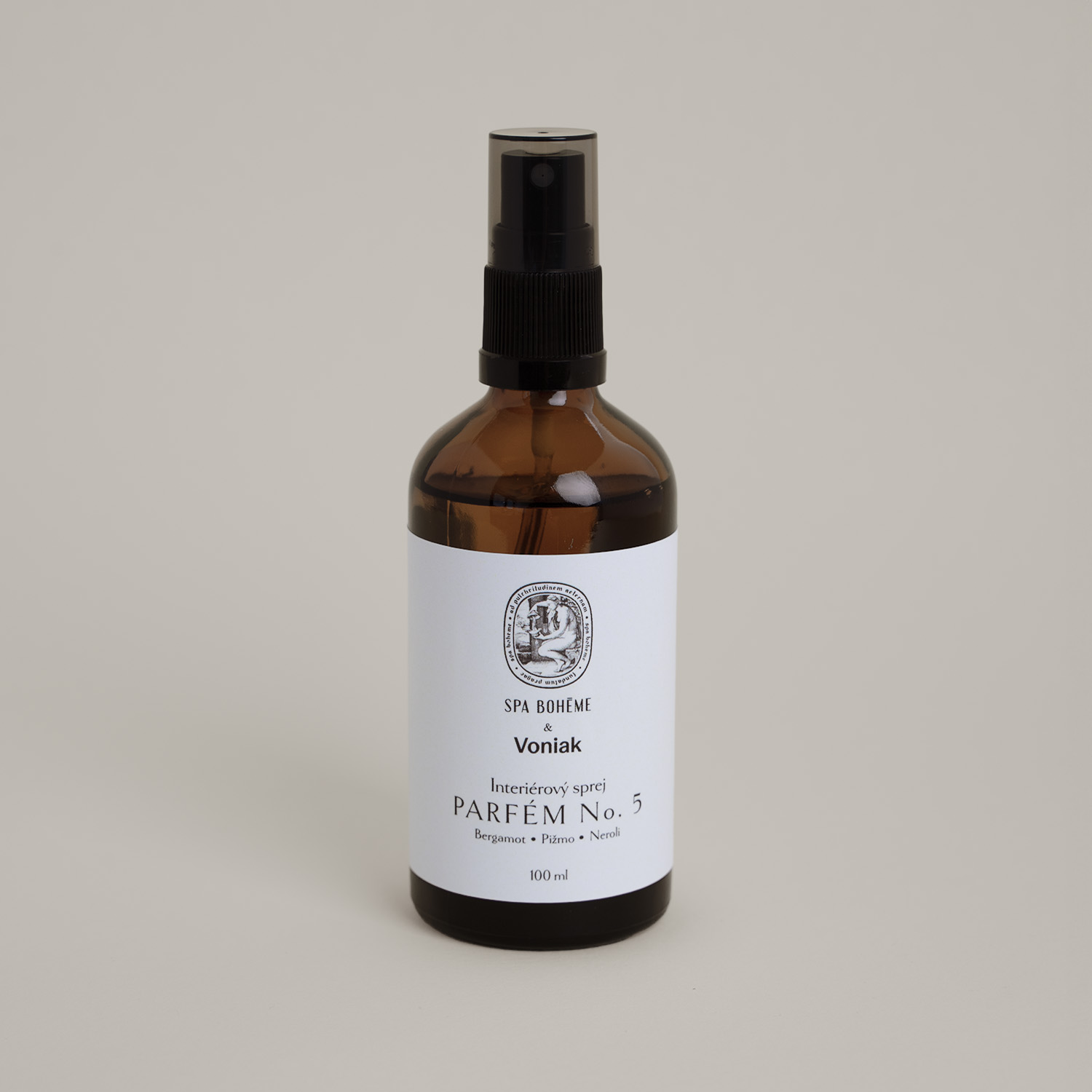 a bottle of liquid parfume with a white label