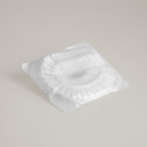 Shower cap in cornstarch bag